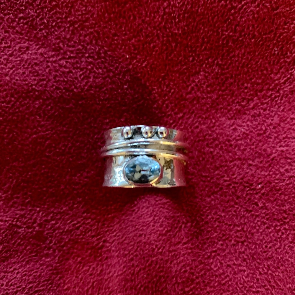 Blue topaz sterling silver spinner ring.